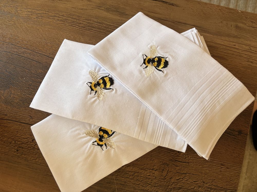 Linen dinner napkins with a metallic-thread bee motif, set of three