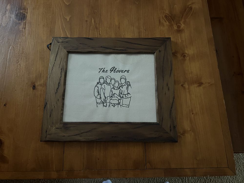Framed fine-line family portrait with the family name embroidered beneath